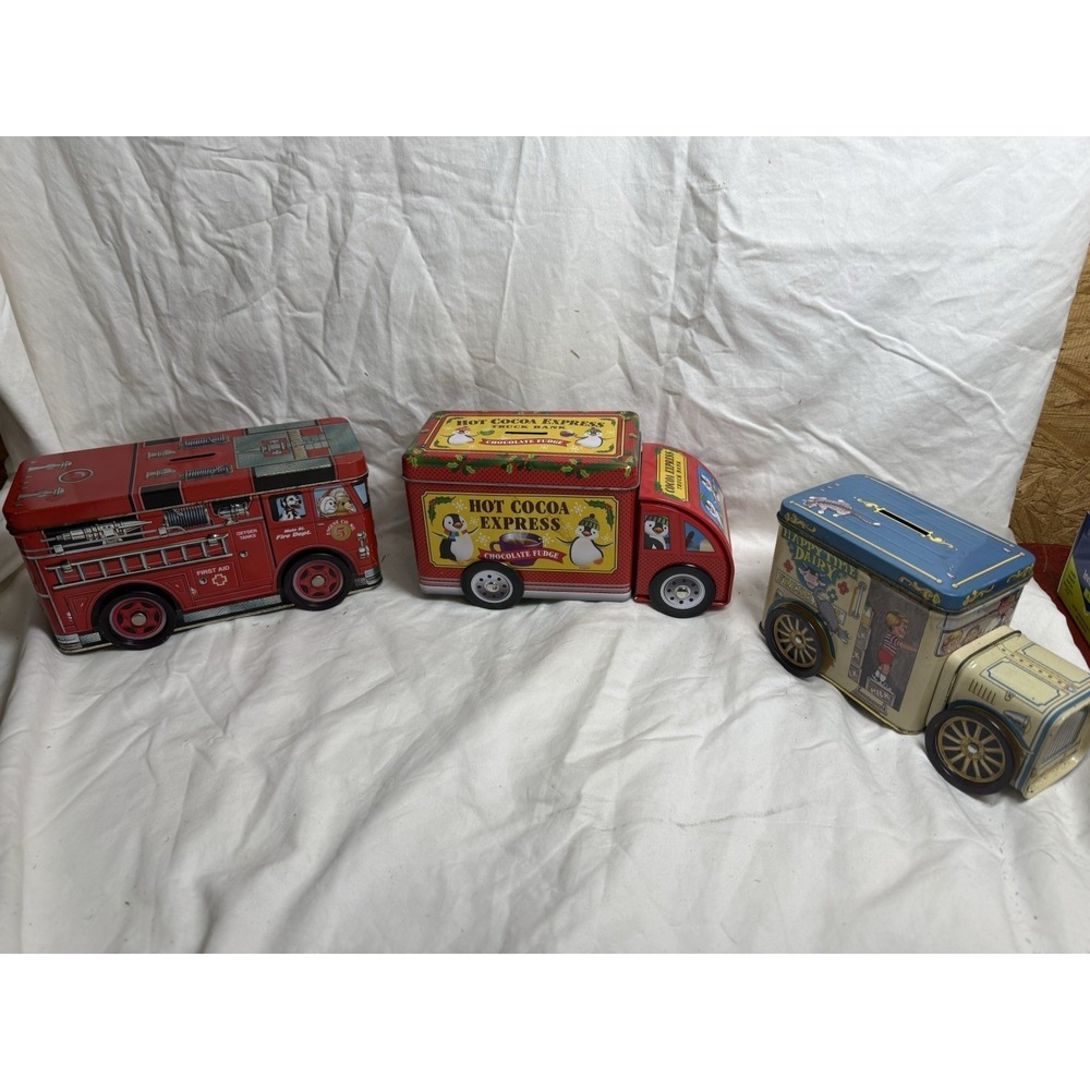 Set Of 3 Tin Truck Coin Banks Fire Truck Happy Time Dairy Hot Cocoa Express